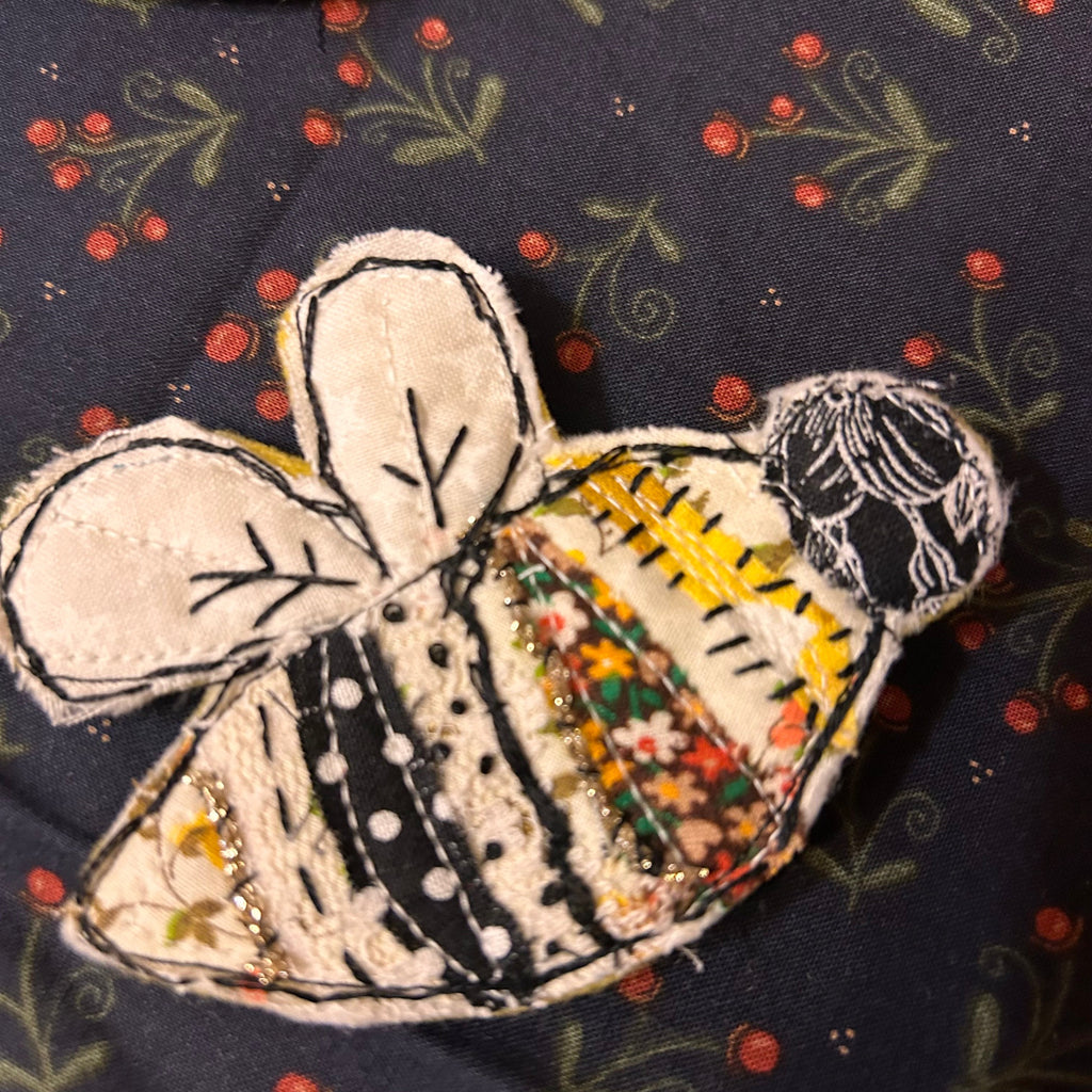 Honeybee slow-stitched pin - mixed fabric bee with white wings